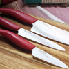 Picture of Revolution 3-Piece Ceramic Knife Set - 6" Chefs, 5" Micro Serrated Tomato and 3" Paring -  Red